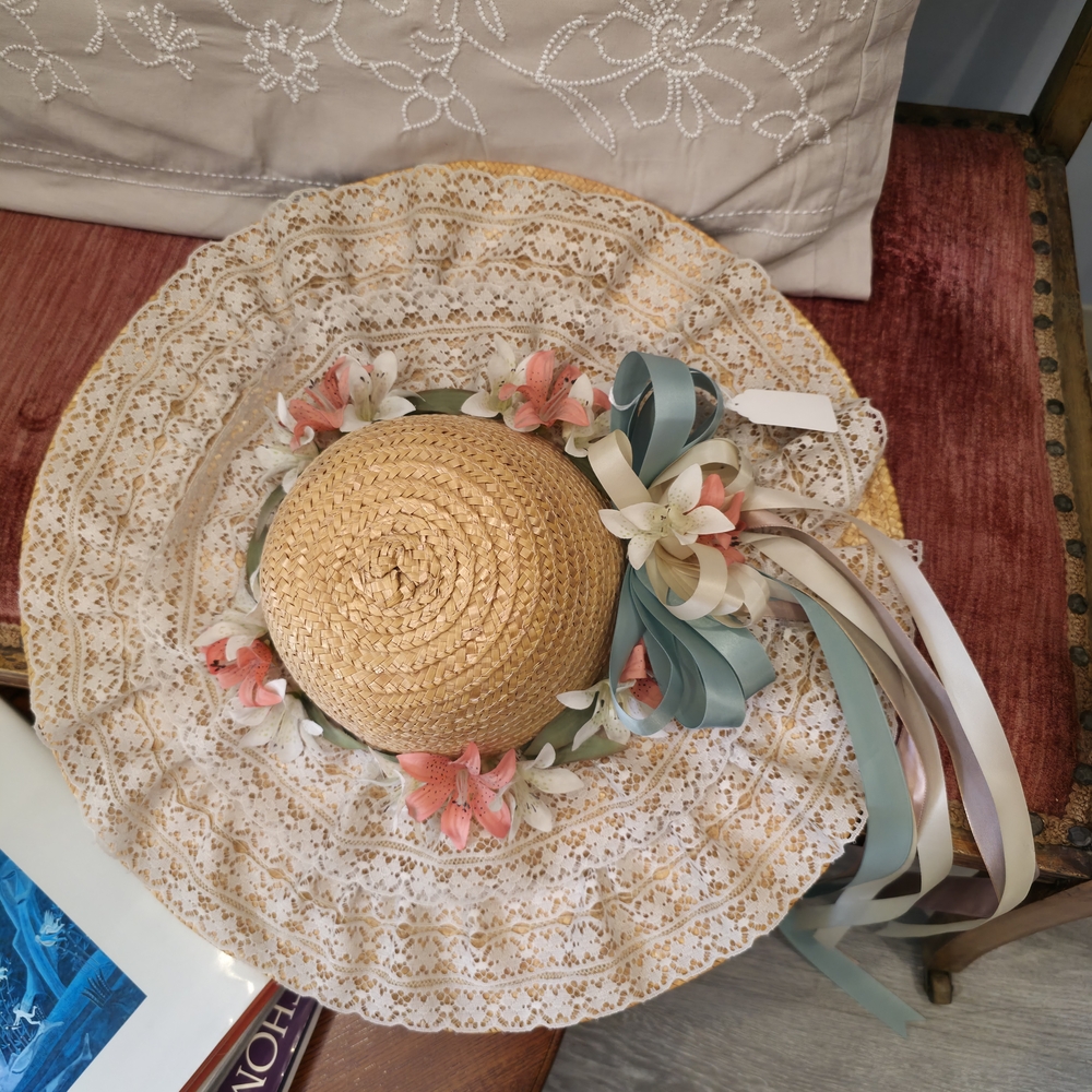 Tan and Pink Wide-Brimmed Straw Hat with Floral Accents